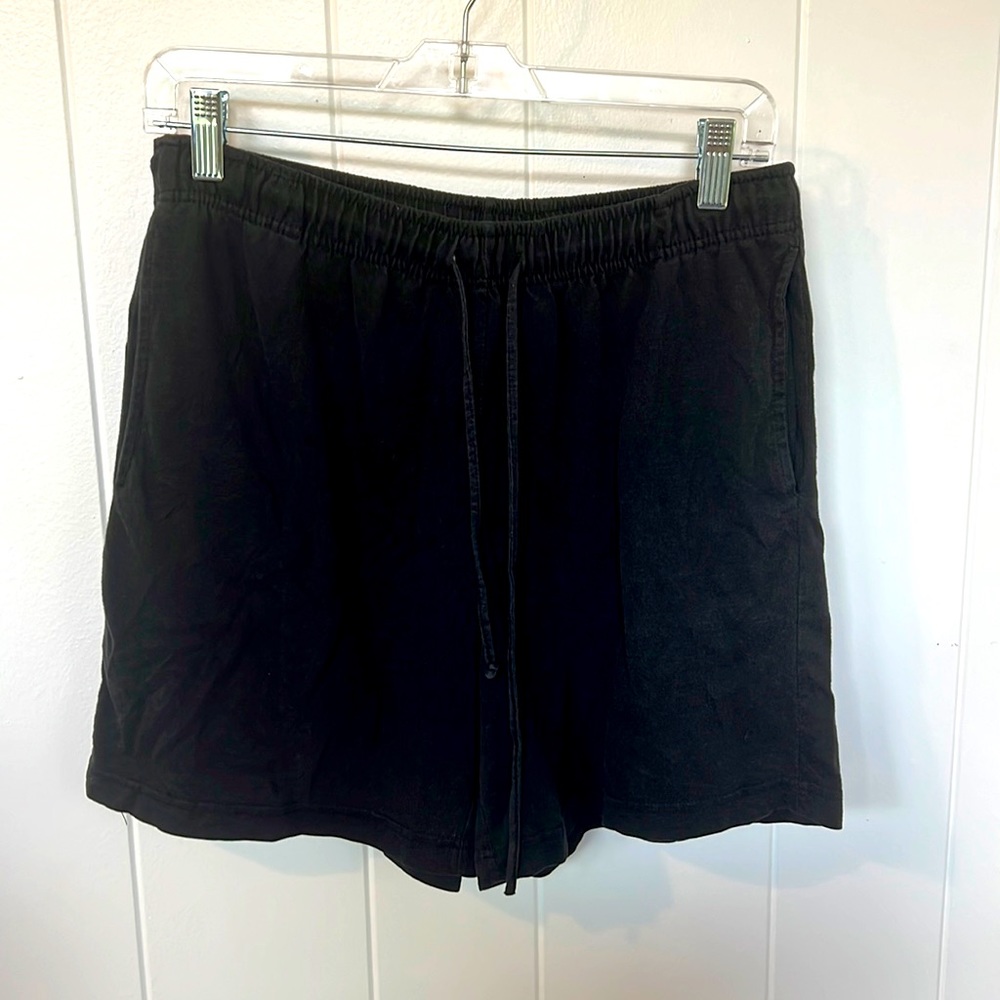 Black track shorts with pockets